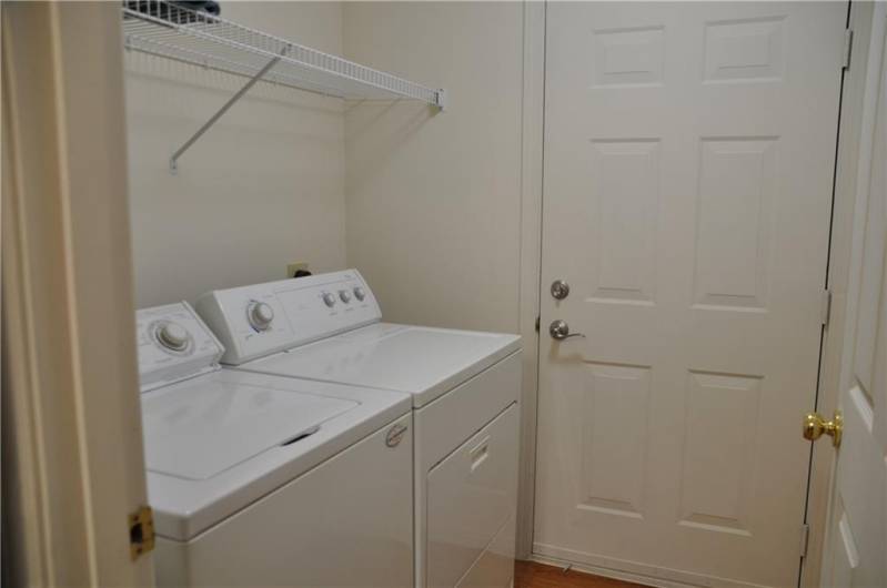 Washer and dryer remain. A second door to exit if desired.