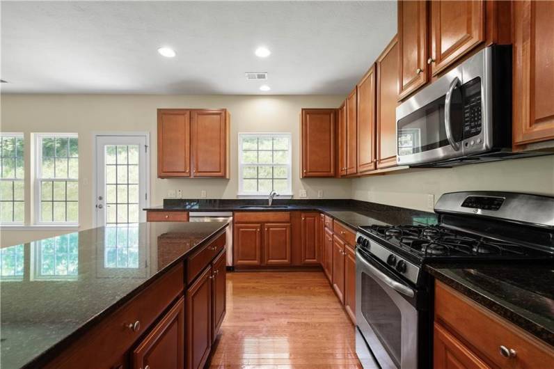 Plenty of cabinets and counter space here!