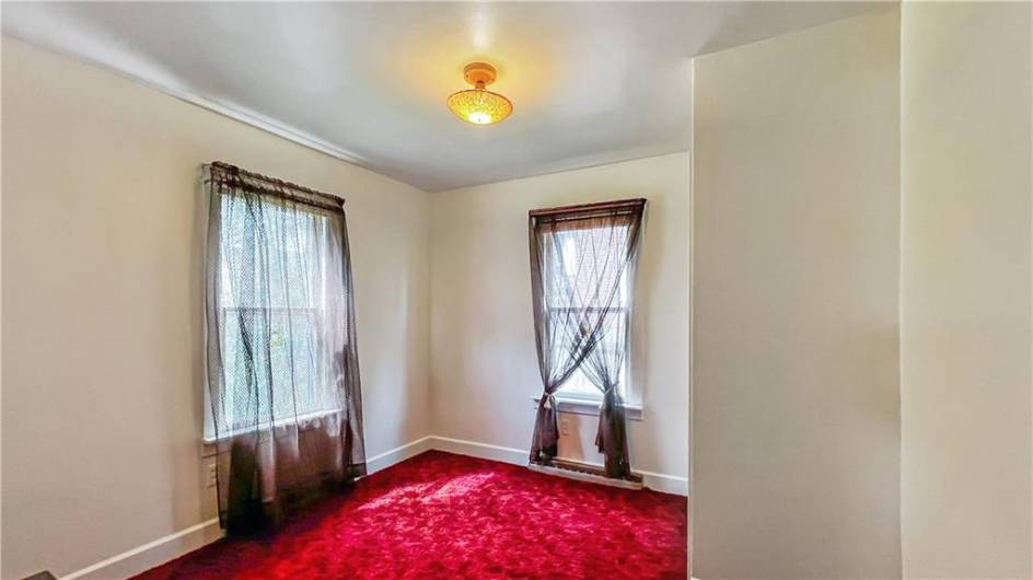 This bedroom has a half bath.