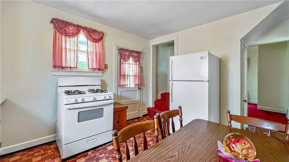 Enjoy family dinners in this cute kitchen.