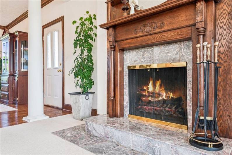Marble surrounded wood burning fireplace