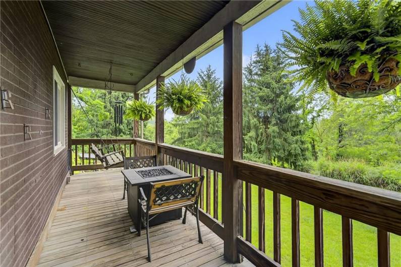 Wowza!  Look at this wonderful covered front porch!!! Relax and watch the rain fall while sipping your favorite coffee or cocktail!