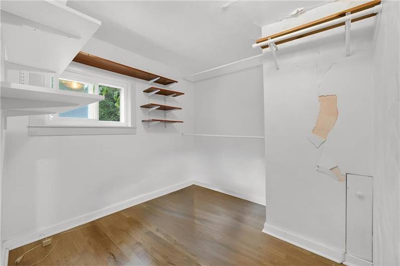 Bedroom number 3 is a cozy space that could also serve as a walk-in closet or office!