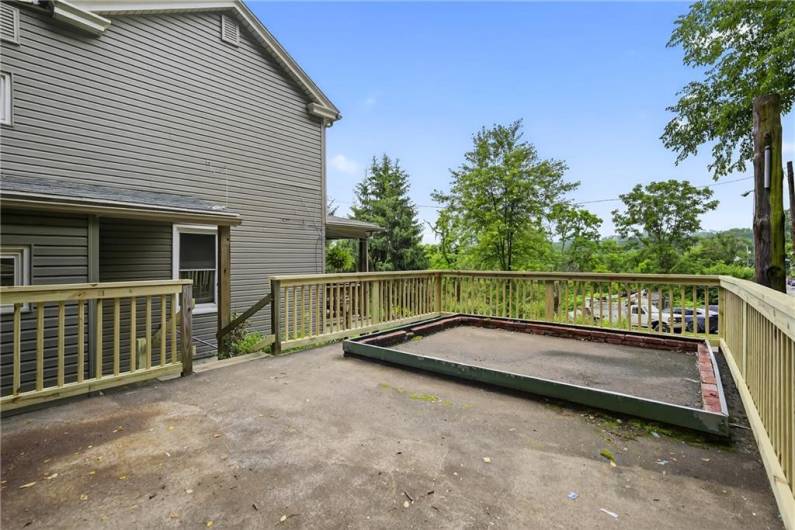 Enjoy the roof top deck above the garage.  Set up your grill and patio set for entertaining! The rectangular bricks have been removed since pics were taken!