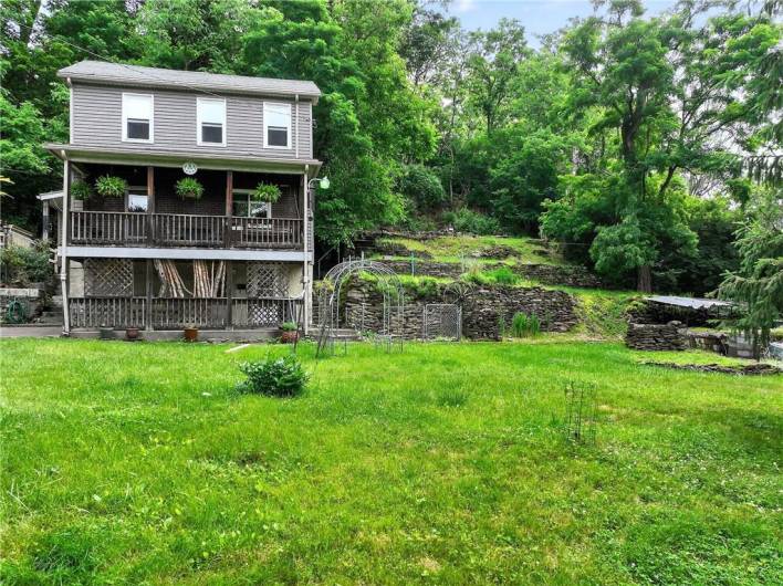 This home is an urban oasis!  So much green and privacy!