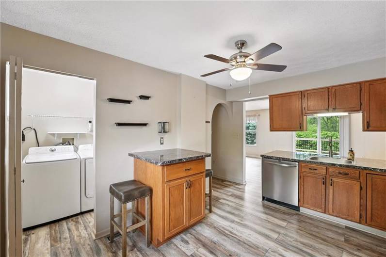 Laundry is located right off the kitchen for convenience. Washer/Dryer are included in sale.