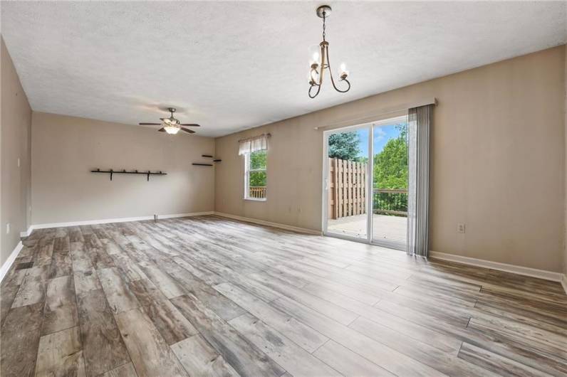 Living room/Dining room combo. With access to upper-level deck.