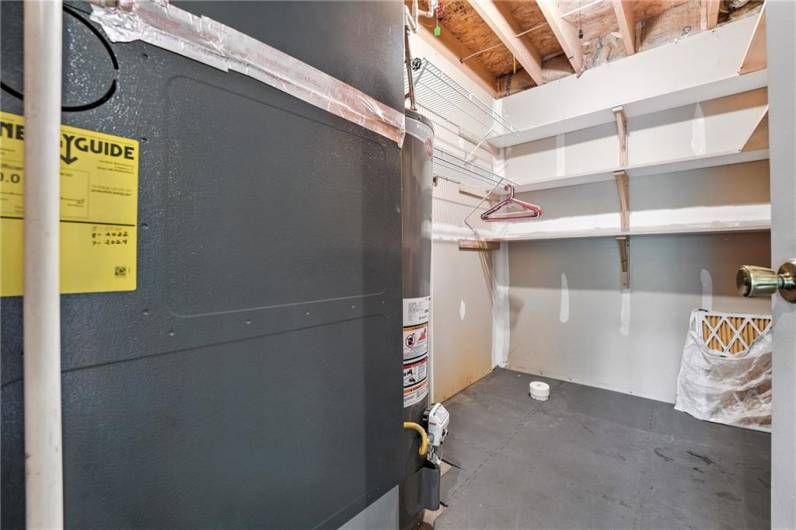 This is the furnace and hot water heater in the basement. Plumbed for another bathroom in the lower level if needed.