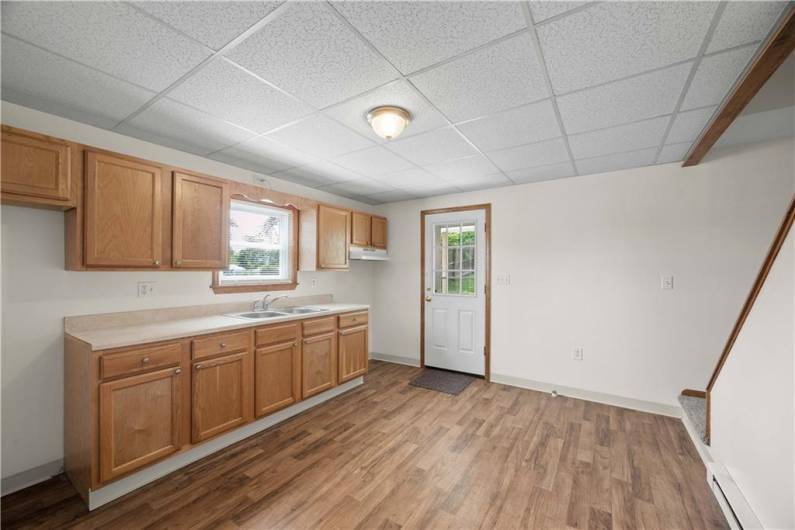 Bright window above sink, easy access to backyard/poured concrete patio