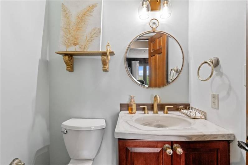 Half bath located in hall by covered porch area on main floor