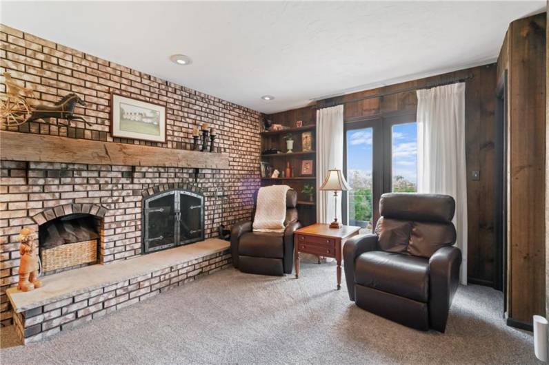 Raised hearth at brick FP w rustic  mantle
