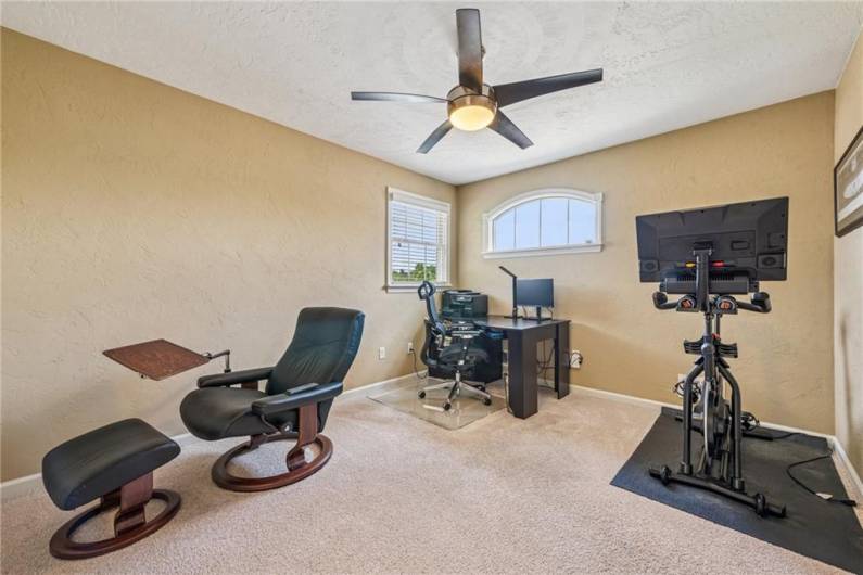 Currently used as an office, this space/bedroom also has a walk in closet.