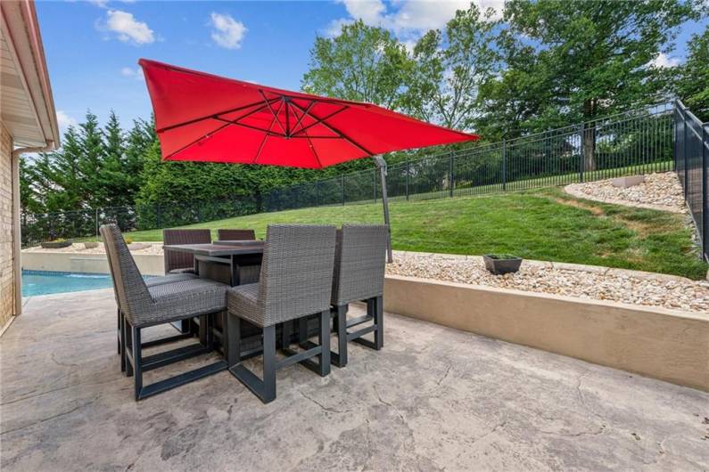 Located behind the garage area is another private and quiet space to entertain.  The pool area is fully fenced for safety.