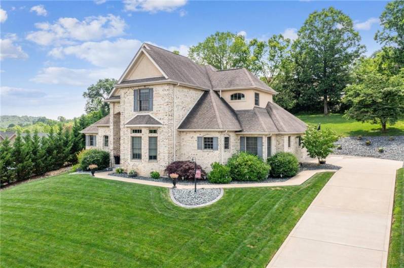 Beautifully landscaped with an extra long driveway for guests