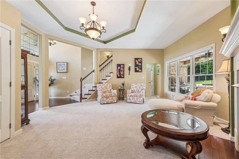 View from the Family Room - beautiful bended staircase leading to the upper level of the home.