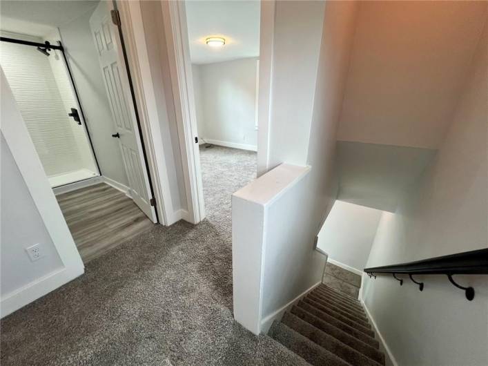 Hallway view of bdrm 1 and bthrm