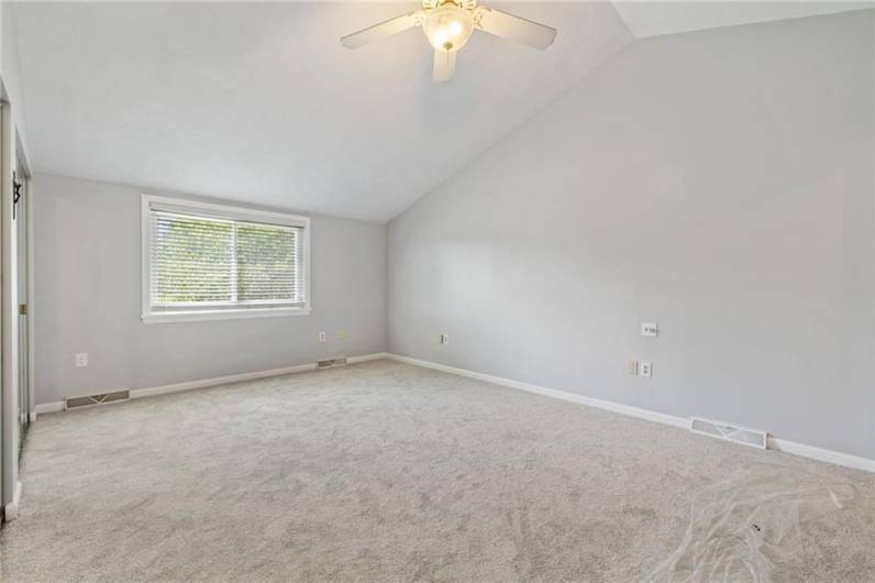 View of primary bedroom without staging.