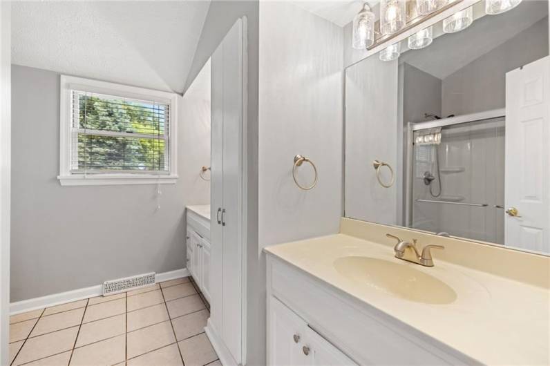 Ensuite features double vanities