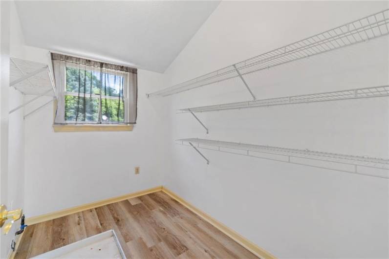 The laundry room is conveniently located in the primary bedroom.
