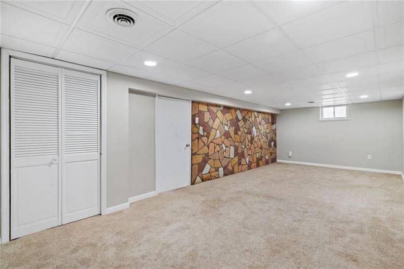 The stone feature wall adds character and charm to the space.