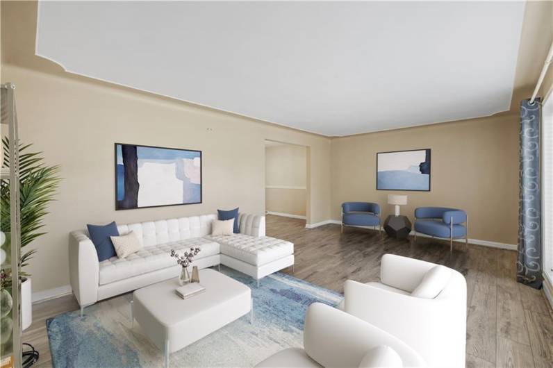 Spacious living room with decorative plaster ceiling.