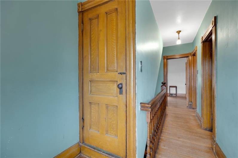 Main hallway at the top of staircase and door leading to large attic!