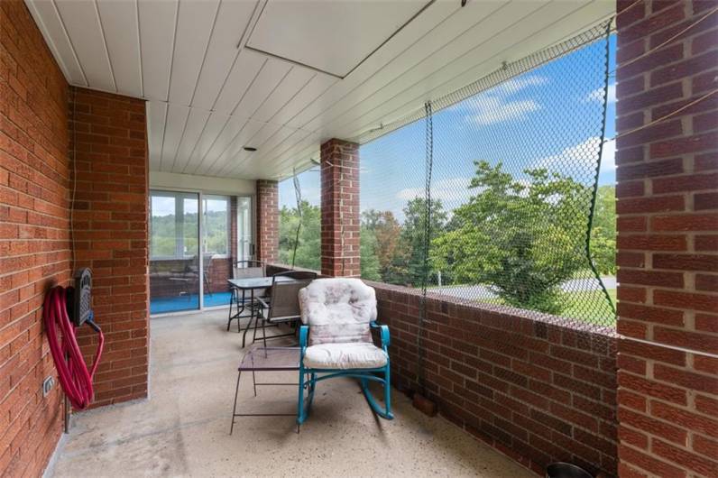 Outdoor patio area with pull down step for storage space