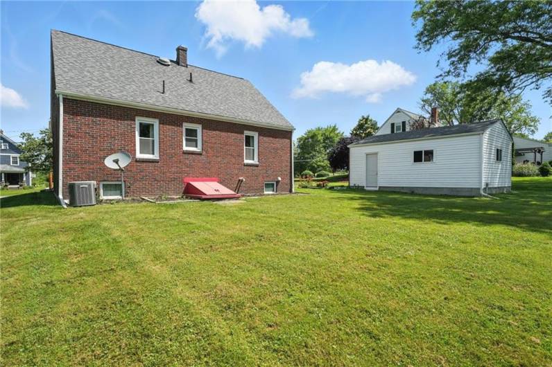 Back of the home with Bilko doors leading into the basement