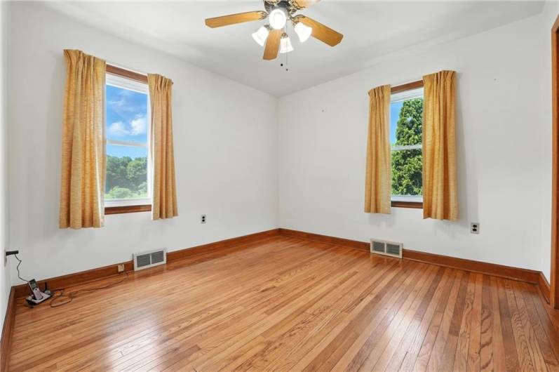 1st bedroom 10x11, with original hardwood floors