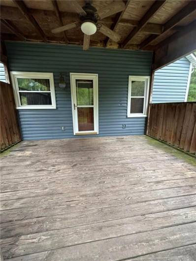 Enter through the kitchen door under the covered porch