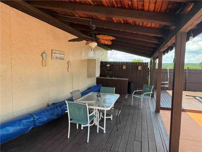 Beautiful covered deck next to pool