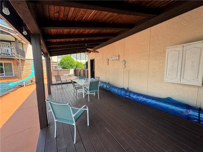 Lovely covered deck next to pool