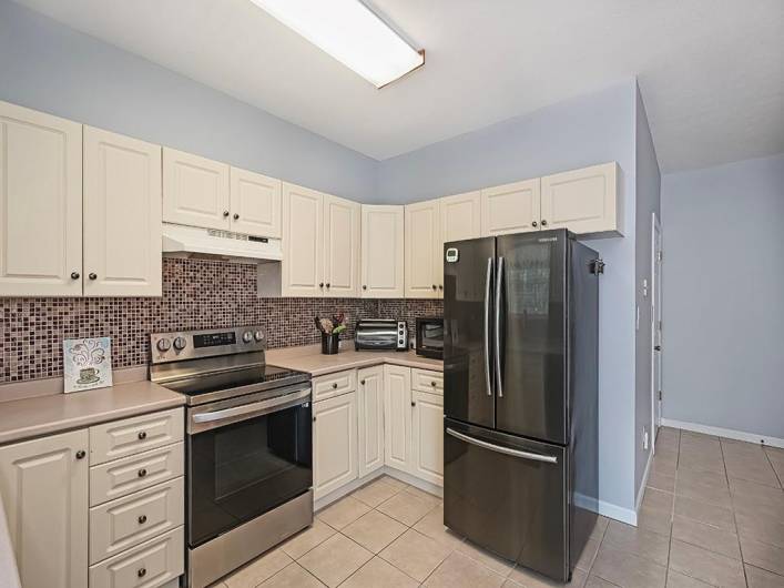 Appliances included- electric range, dishwasher, refrigerator, disposal.