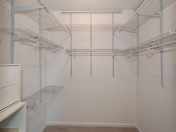 Walk-in closet in primary bedroom.