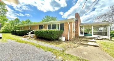 Front of home with side patio