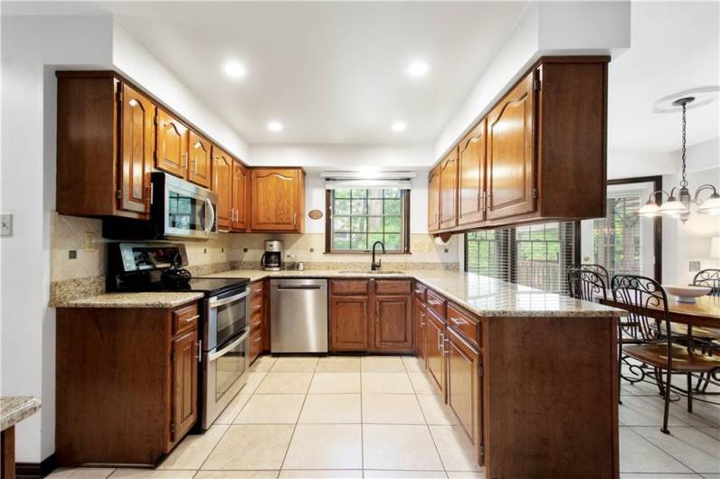 Kitchen has granite counters, ss appliances, and lots of cabinets!