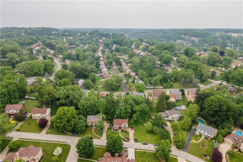 Aerial view of the front of the home and the neighborhood!