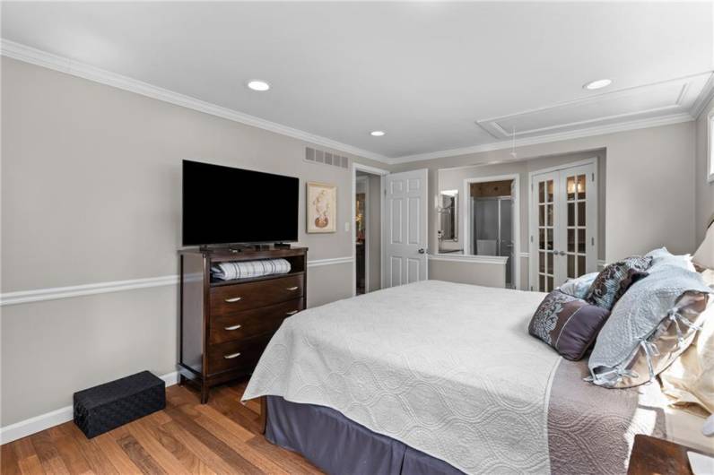 French doors lead to the walk-in closet with built-in closet organizers.