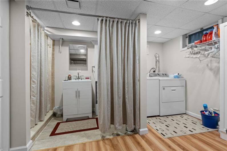 Full bathroom with shower in the game room.