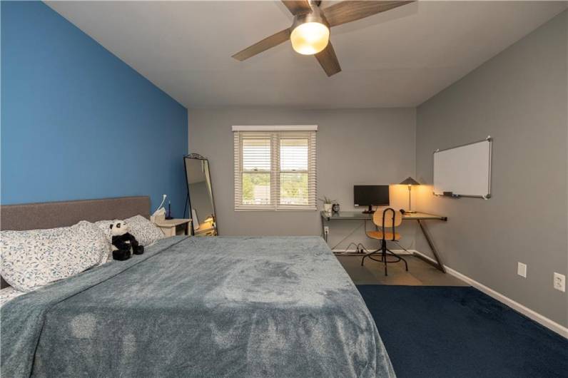 Third bedroom is roomy with charming front-facing views