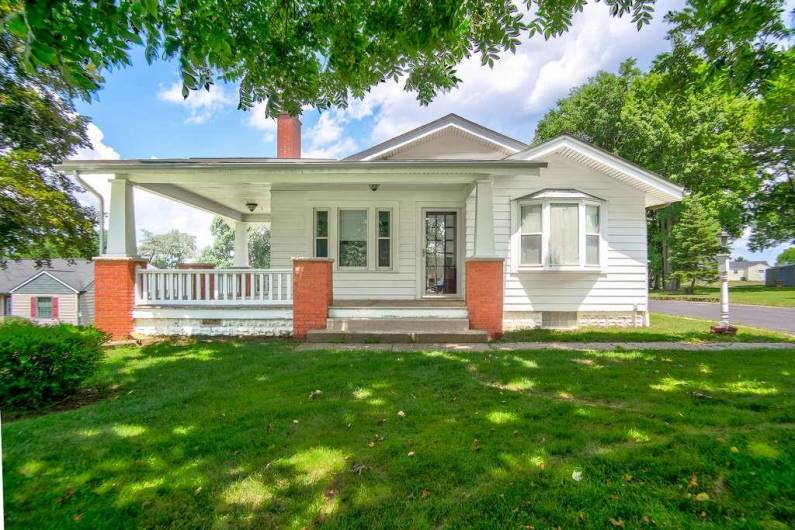 Welcome your guests onto a warm and inviting covered porch!