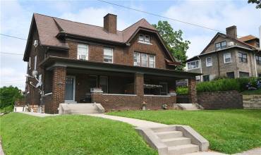Corner Lot - Side by Side Brick Duplex with great curb appeal and facing Frick Park.  Newer Roof and Windows, and two front porches.