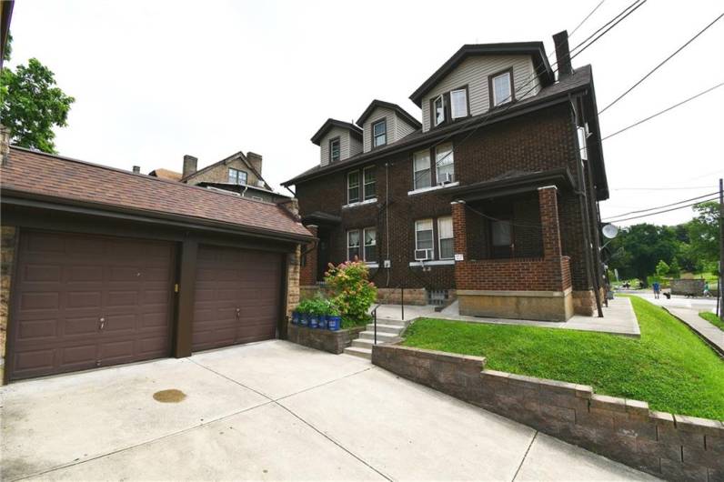 Rear of home and Double Garage with additional driveway parking and easy access from street