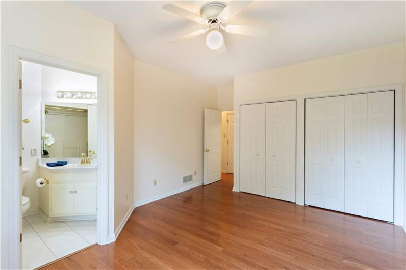 Master suite features hardwood floors, two double closets, and a full bathroom.