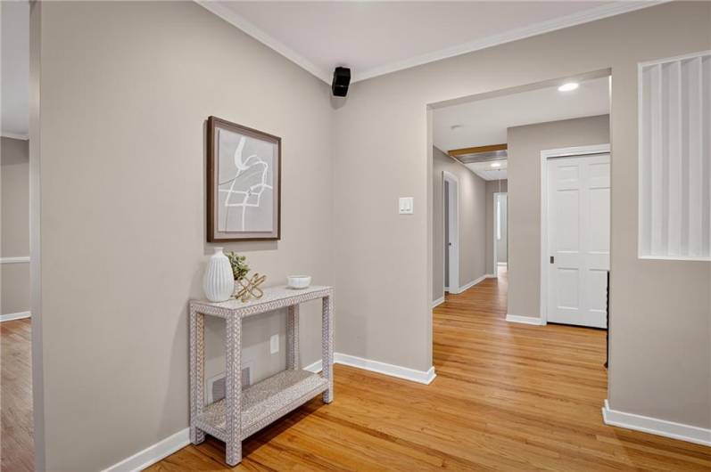 Living room opens to the hall that leads to three bedrooms and the hall bath.