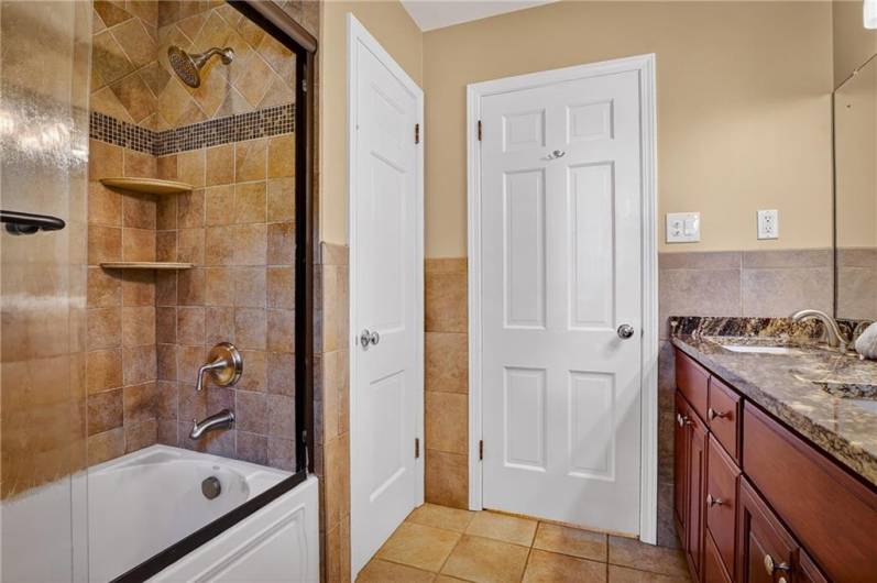 The primary bathroom offers a private retreat with its spacious layout.