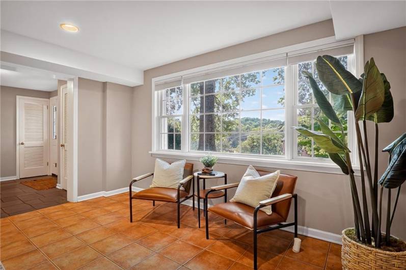 A bright corner with large windows that let in plenty of natural light.