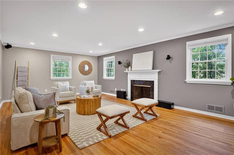 This inviting living room features a warm and modern design with neutral tones and natural wood accents.