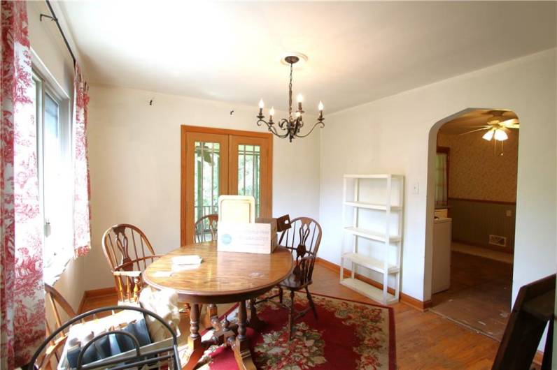 Another View of Formal Dining Room w/ Glass French Doors to Screened-in Porch
