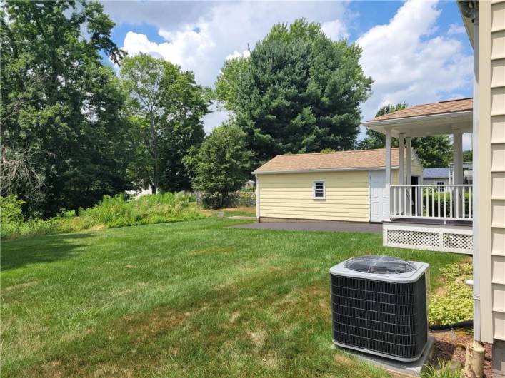 Backyard view - Detached garage area.  New heating and cooling system - 2023